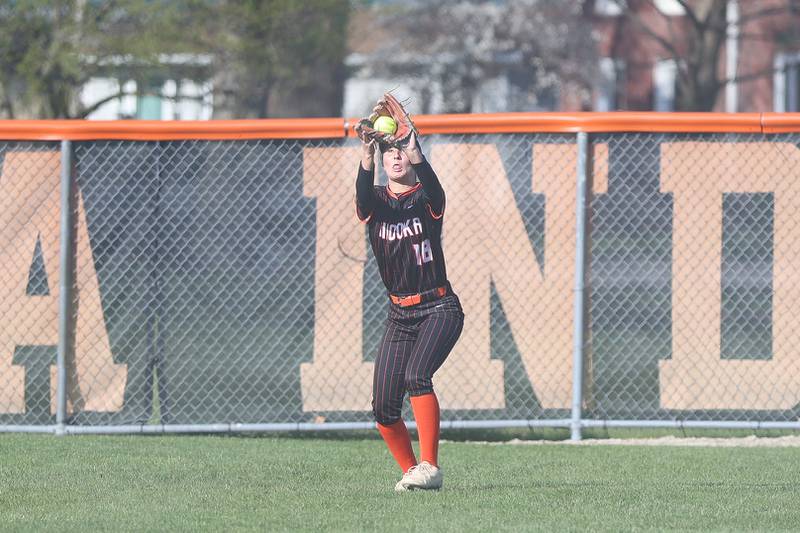 Minooka’s Olivia Boyd pulls in a fly ball and subsequently throw out a Joliet Catholic runner trying to score on Tuesday, April 7, 2026 in Minooka.