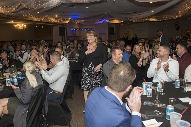 Debbie Bley approaches the stage after being named Volunteer of the Year Friday, May 6, 2022 at the Best of Dixon awards.