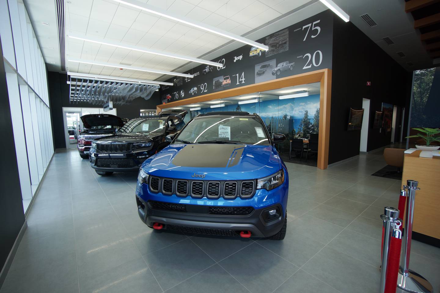 Vehicles in the Lockport Bettenhausen Chrysler-Dodge-Ram-Jeep dealership showroom.