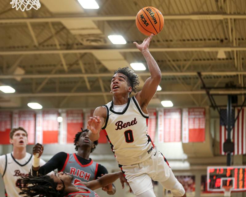 Benet's Blake Fagbemi (0) is fouled on a drive to the basket during their When Sides Collide Shootout basketball tournament matchup between Rich Township at Benet Academy. Jan 25, 2025 in Lisle.