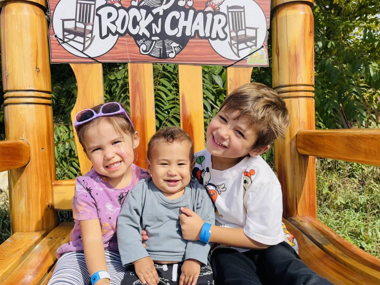 St. Charles cancer patient Arlie Robken (left) and her brothers Clay (center) and Sutherland (right) pose for a photo.
