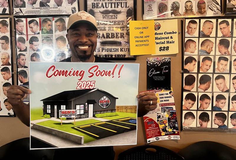 Ben Phillips, owner of Ben's Phresh Kutz, holds a mock-up image for his new barbershop at 217 Second Ave. in Rock Falls, Illinois, which is tentatively set to open later this year.