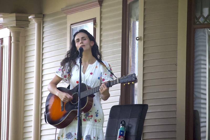 Lucy Isabel, a folk/Americana singer-songwriter, erforms in the 600 block of Western Avenue in Joliet as part of the Porch and Park Music Fest on Saturday, Aug. 16, 2025.