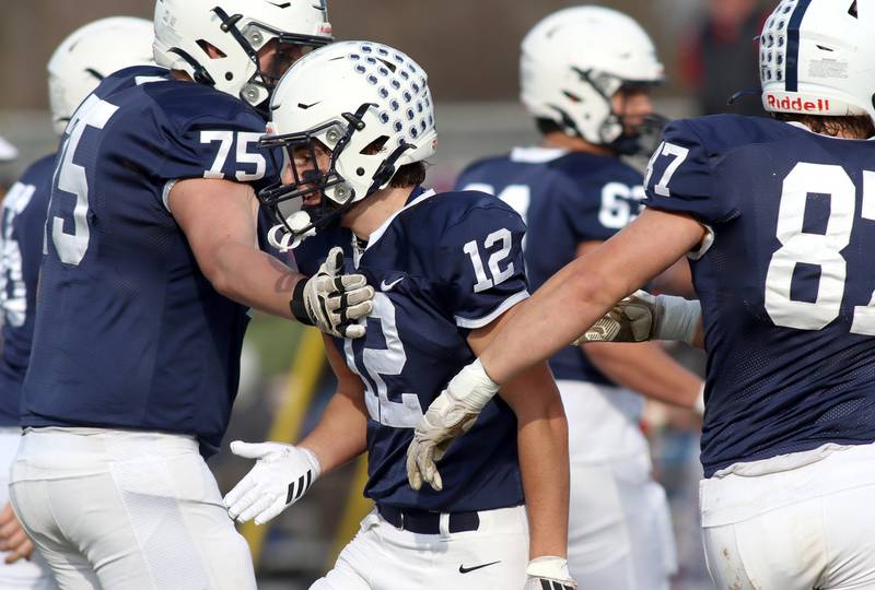 Cary-Grove’s Landon Barnett is greeted after making a touchdown reception against Belvidere North in IHSA Class 6A quarterfinal playoff football action on Saturday, Nov. 16, 2024, at Al Bohrer Field on the campus of Cary-Grove High School in Cary.