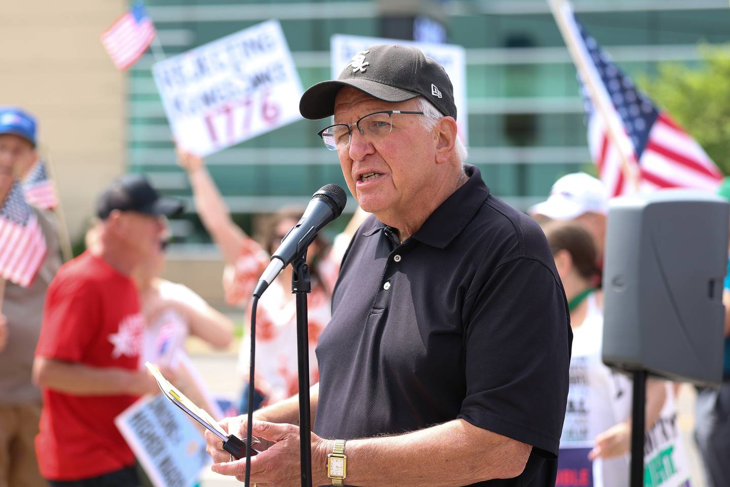 Former State Sen. Pat McGuire of Joliet speaks at the No Kings Day protest at the intersection of West Jefferson Street and Larkin Avenue on Saturday, June 14, 2025 in Joliet.