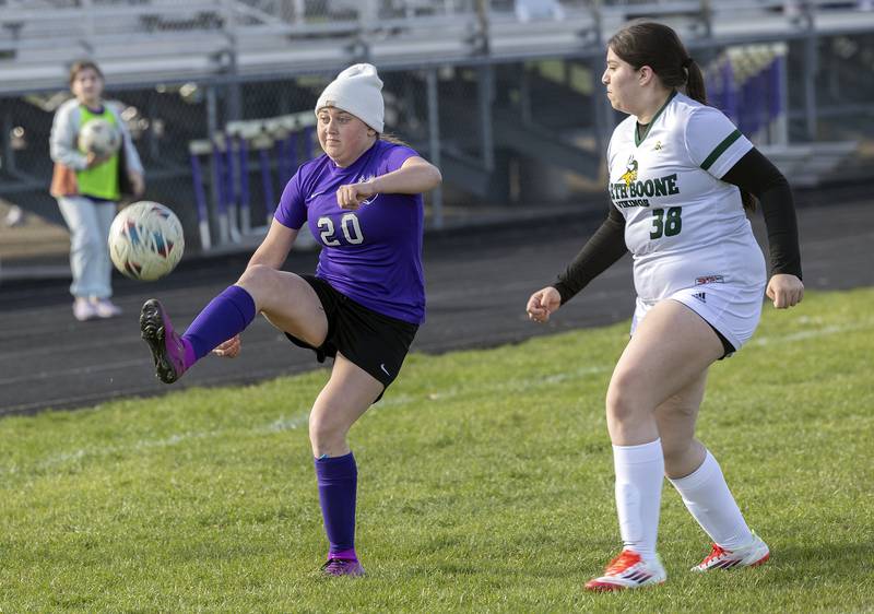 Dixon’s Carlie Cook handles the ball against North Boone’s Bryssa Ramirez Tuesday, April 15, 2025.