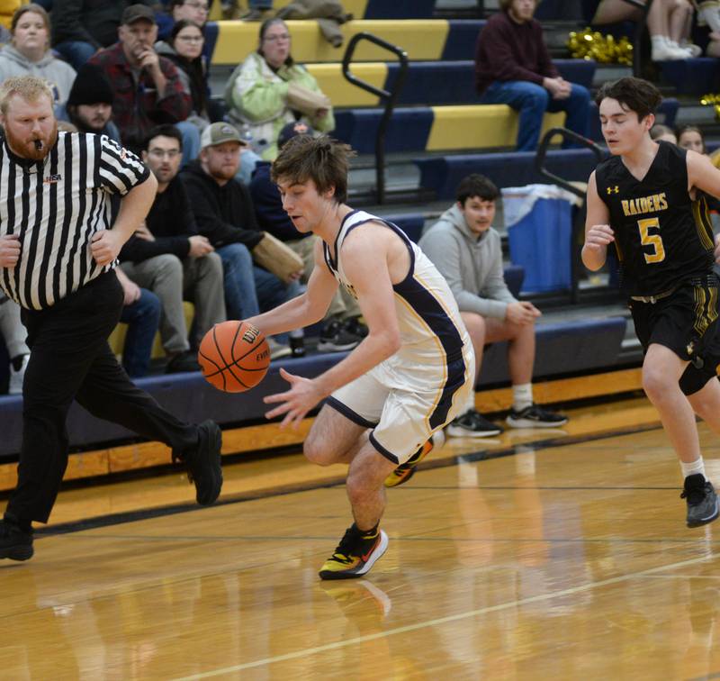 Polo's Brock Soltow heads up the court after stealing the ball against Ashton-Franklin Center on Tuesday, Jan. 2, 2024 at Polo High School.