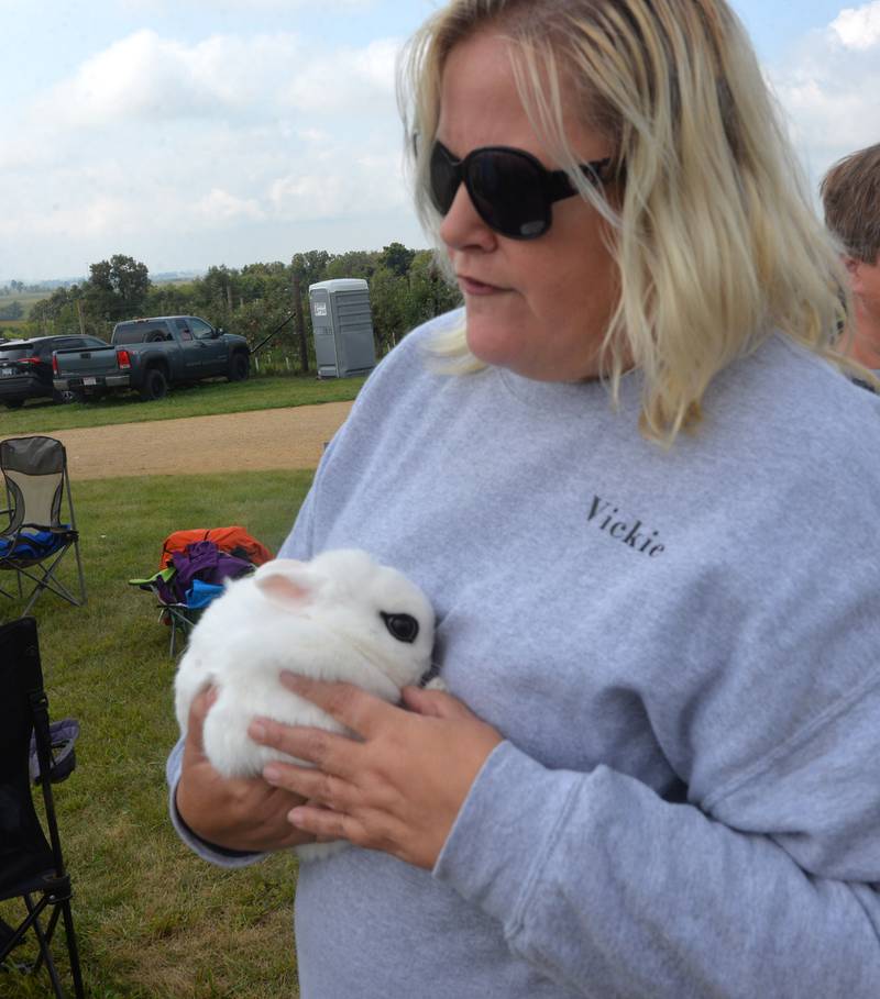 Vickie Smith hold Luna, a 4-year-old dwarf hotot rabbit, that was part of the Summerhill Huskies 4-H Club's petting zoo at BerryView Orchard on Sunday, Sept. 17, 2023. Smith takes the bunny to visit with residents at the Franklin Grove Nursing Home.