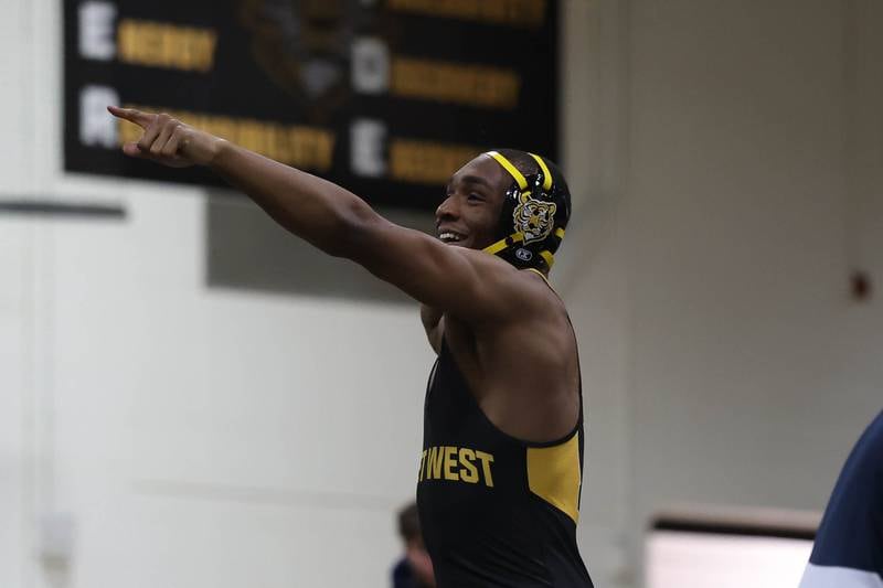 Joliet West’s Aiden Brown points to the crowd after his win over Plainfield South’s Julius Pierscionek in the 175 pound match on Wednesday, Dec. 3, 2025 in Joliet.