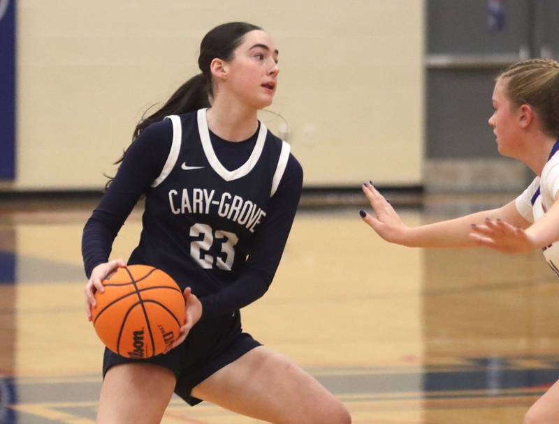 Cary-Grove’s Avery Hoffman moves the ball against Lakes in varsity girls basketball action on Friday, Jan. 2, 2026  at Lakes High School in Lake Villa.