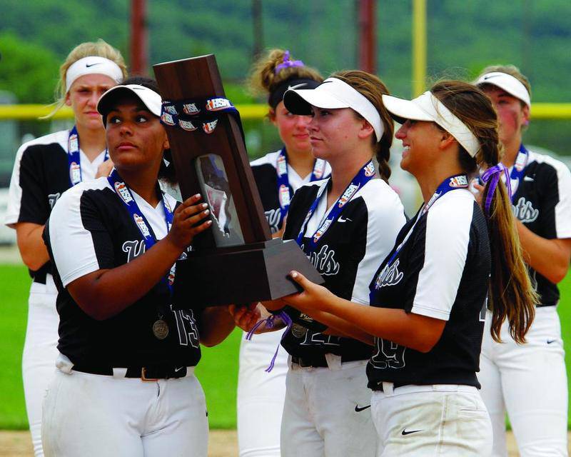 Hannah Theobald, Lexi Abruzzo and Katie Kurzrock receive Kaneland's second-place trophy during the Class 3A championship game awards ceremony on Saturday, June 9, 2018. The Knights fell 15-8 after 12-run seventh inning rally by the Montini Lady Broncos.