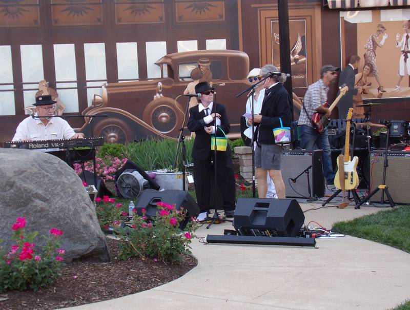 Toni Pettit (left) and Cinda Bond (right) welcome spectators Friday, June 2, 2023, to Heritage Park for another summer of Jammin' at the Clock. The concert series runs every Friday throughout the summer from 6 to 8 p.m.