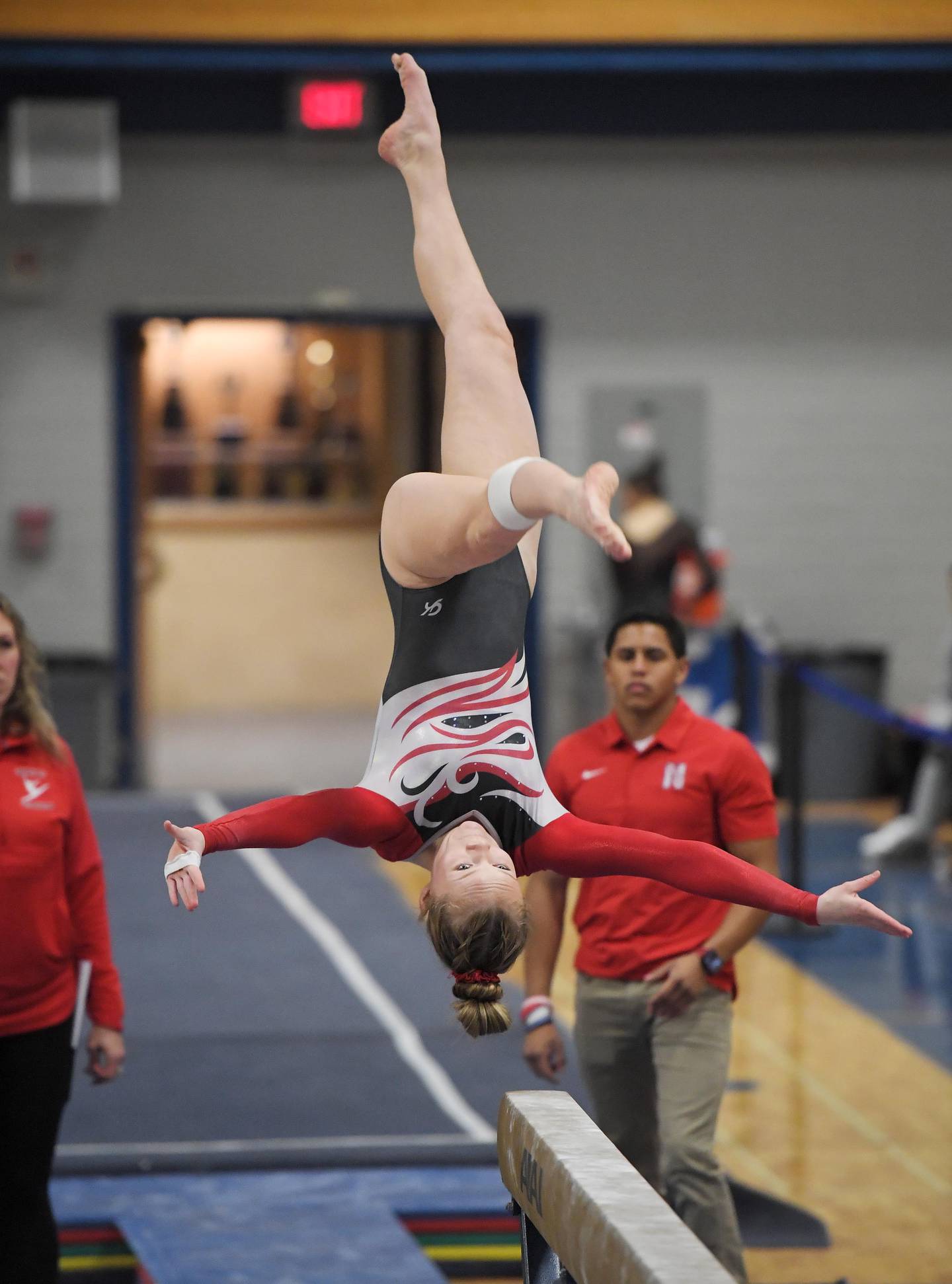 Naperville Central’s Alana Williams performs on the beam at the Geneva girls gymnastics regional meet in Geneva on Wednesday, February 1, 2023.