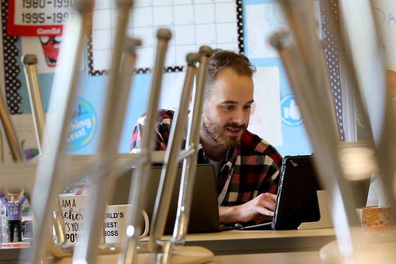 Creekside Middle School sixth- and seventh-grade math teacher William Shea conducts a remote learning class Oct. 1 through Canvas Conferences from his empty classroom at Creekside Middle School in Woodstock.