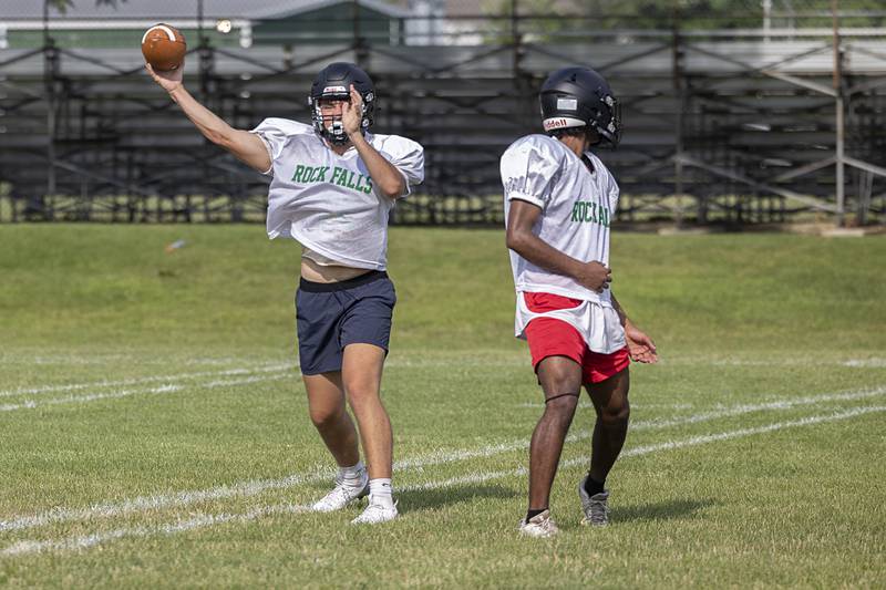 Rock Falls QB Mason Landes fires a pass Tuesday, July 16, 2024, during drills at football camp.