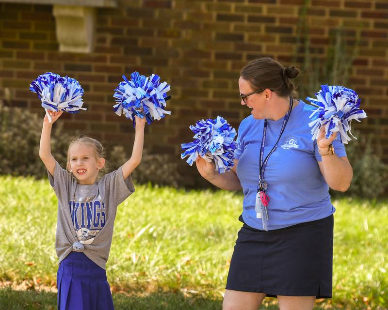 Emily Crockett, 6, and her mom, Joanna Crockett of Geneva, cheer before the start of the Geneva High School Homecoming Parade on Friday, Sept. 26, 2025, along State Street in downtown Geneva.