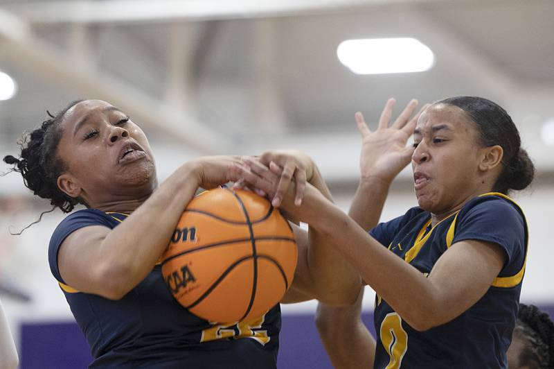 Sterling’s Joslyn Green (left) and Alivia Gibson fight for a rebound Saturday, Dec. 27, at the Duchesses Basketball Christmas Classic.