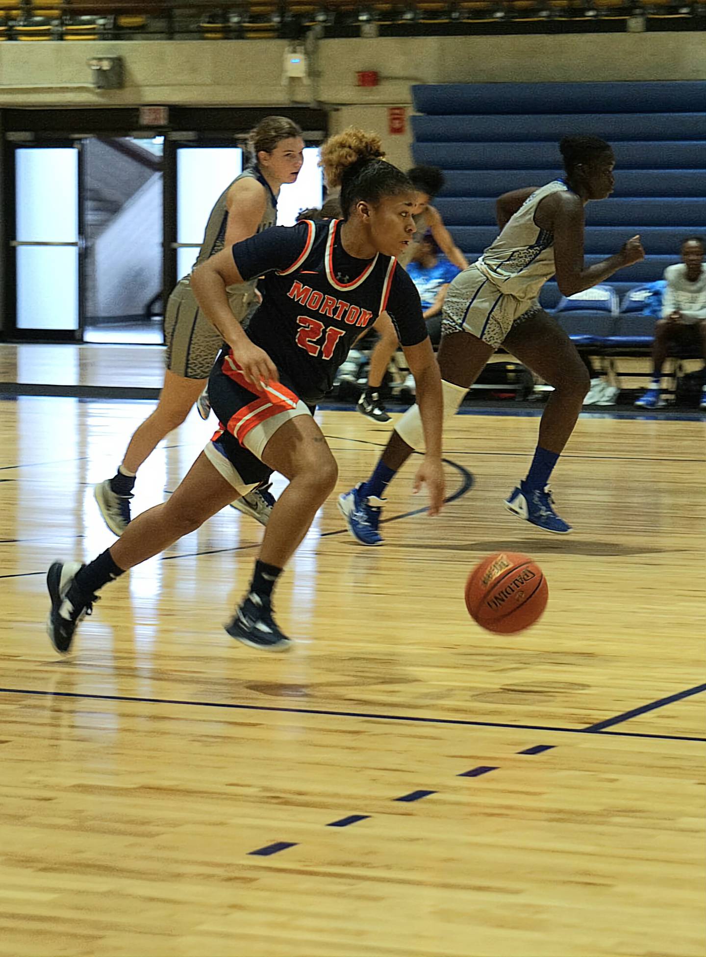 Morton College guard and former Nazareth star Kaylen Evans dribbles the ball up the court during a game this season.