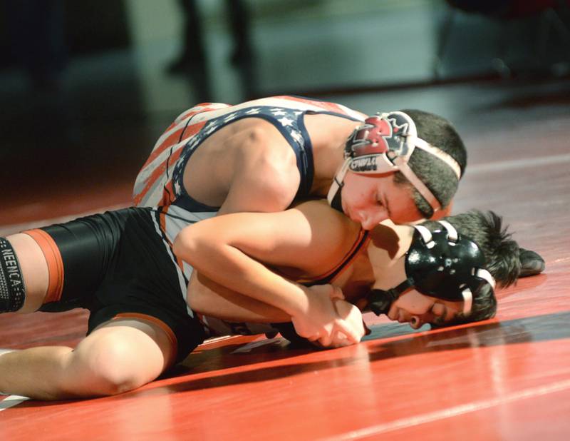 Morrison's Cael Wright (top) holds his Sandwich opponent during a 106-pound match at a triangular meet with Oregon on Friday, Jan. 31, 2025 in the Blackhawk Center at Oregon High School.