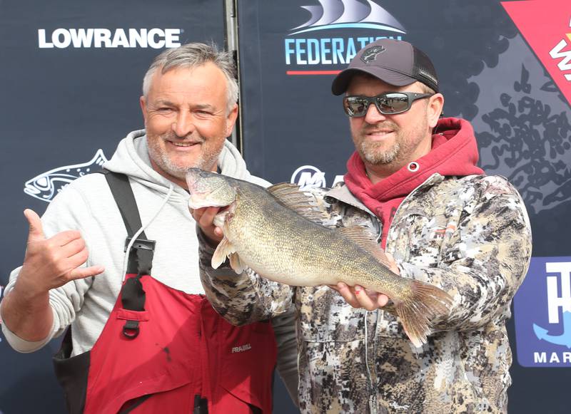 Jason Peach and Chris Ott hold their big Walleye fish during the annual Masters Walleye Circuit tournament on Friday, March 21, 2025 at the Spring Valley Boat Club.