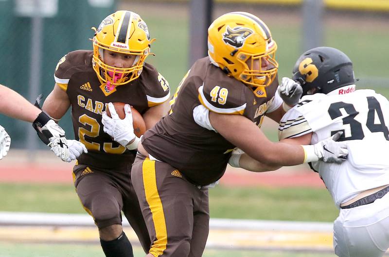 Carmel's Donovan Dey carries the ball during their Class 5A second round playoff game against Sycamore Saturday, Nov. 5, 2022, at Carmel Catholic High School in Mundelein.