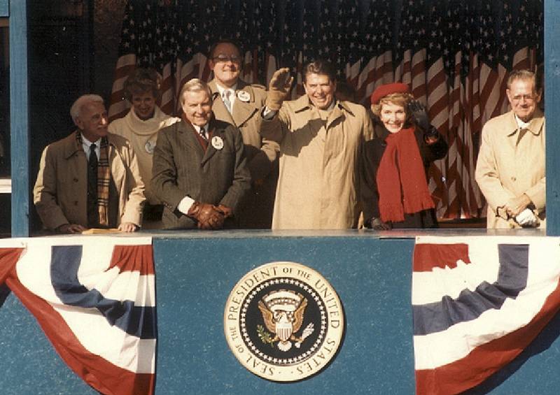 The reviewing stand at First & Hennepin. (From left) Dan Terra, Lynn Martin, Chuck Percy, Jim Thompson, Ronald and Nancy Reagan, and Neil (Moon) Reagan.