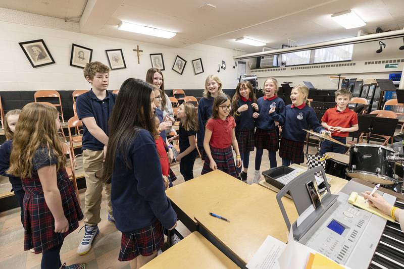 St. Mary School students belt out the theme to "Spongebob Squarepants" as part of the scavenger hunt Wednesday, Feb. 1, 2023.