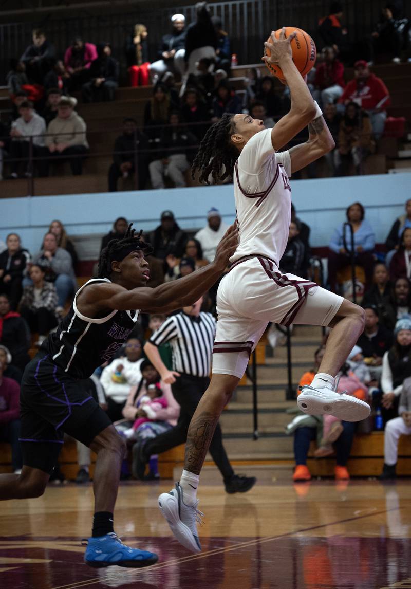 Kankakee's Lincoln Williams is intentionally fouled by Thornton's Deandre Higgs, left, in a game on Friday, December 12, 2025.