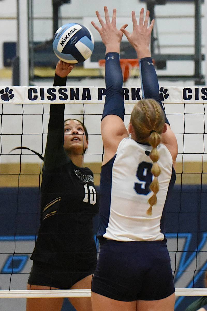 Bishop McNamara's Trinitee Thompson, left, looks to send a hit past Cissna Park's Addison Lucht during a game at Cissna Park Wednesday, Oct. 15, 2025.