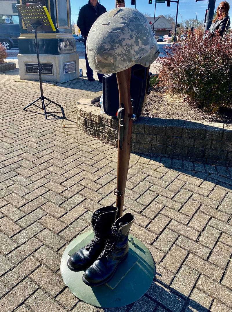 A soldier's boots, gun and helmet were displayed during the DeKalb American Legion's annual Veterans Day ceremony in downtown DeKalb's Memorial Park on Saturday, Nov. 11, 2023. The display was meant to honor all who've served or given their lives in service to the country.