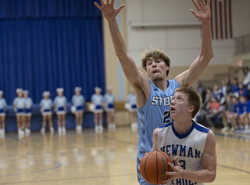 Newman’s George Jungerman looks to put up a shot against Bureau Valley’s Landon Hulsing  Friday, Jan. 26, 2024 at Newman High School.