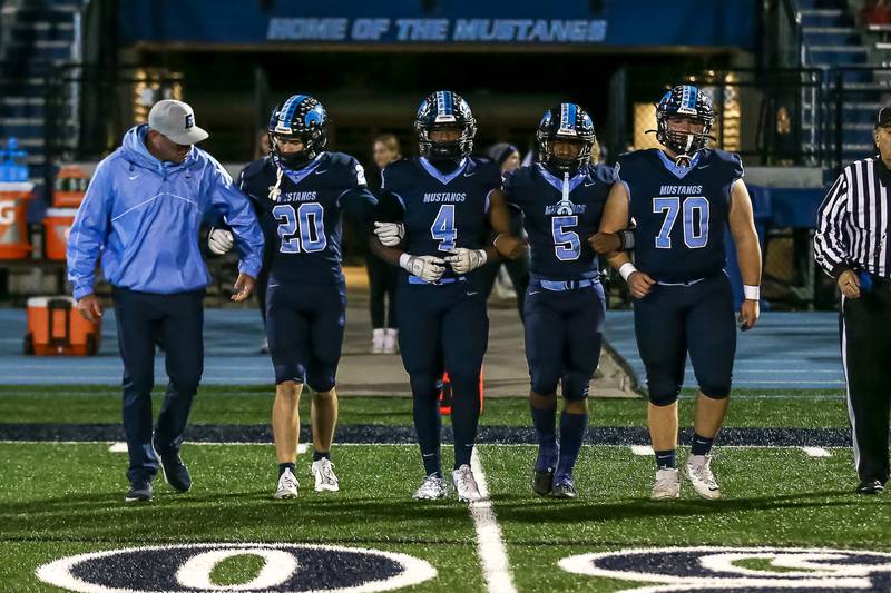 Downers Grove South comes out for the coin toss before Class 8A Playoff football game between Plainfield South at Downers Grove South on Friday, Nov 1, 2024  in Downers Grove.