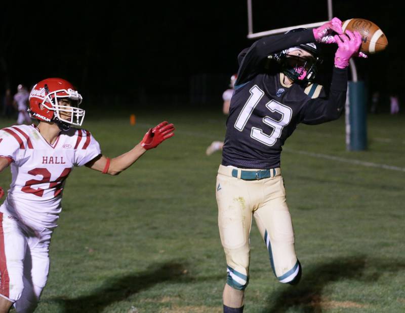 St. Bede's Ben Wallace (13) makes a catch over Hall's Joel Rangel to score a touchdown on Saturday, Oct. 15, 2022 at the Academy in Peru.