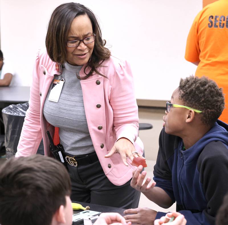 Treveda Redmond, principal at Huntley Middle School, talks to sixth-grade students during lunch Tuesday, March 14, 2023, at the school in DeKalb.