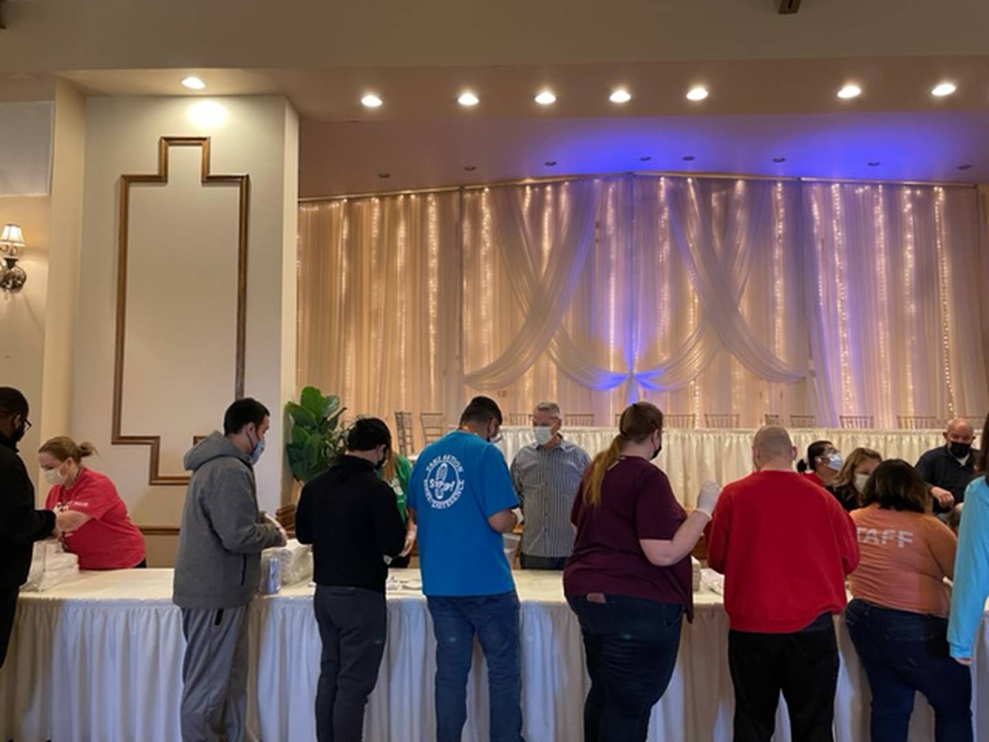 Members of multiple Joliet-area organizations, including All Saints Greek Orthodox Church in Joliet, the Kiwanis Club of Joliet, the Kiwanis’ Aktion Club and Aktion Angels Club and the Greater Joliet Area YMCA, worked together to purcahse the items for and then assemble hundreds of hygiene kits for the Ukranian refugees. Pictured are volunteers from the packing event at the Jacob Henry Mansion Estate in Joliet.