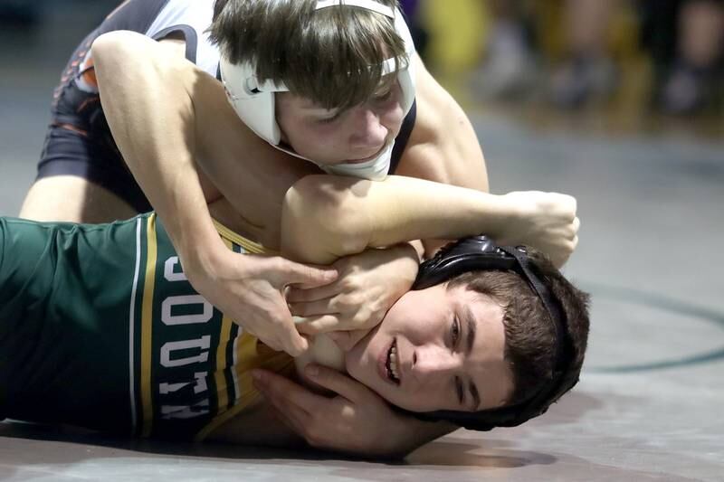 Crystal Lake South’s Glen Donahue, bottom, battles McHenry’s Lucas Van Diepen in a 120-pound match during varsity wrestling at Crystal Lake Thursday night.
