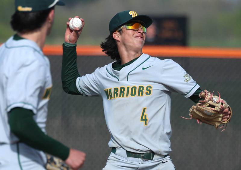 Waubonsie Valley's Scott Gillen fires the ball to first Monday, April 20, 2026, during their game at DeKalb High School.