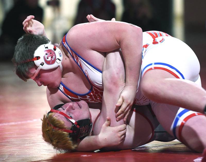 Oregon's Jacksyn Windam holds Fulton's Christian Mitchell on the mat during the 215-pound match on Thursday, Dec. 4, 2025 at Oregon High School.