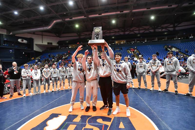 Montini captains receive the Class 2A third place trophy at the IHSA Dual Team State Finals on Saturday, March 1.