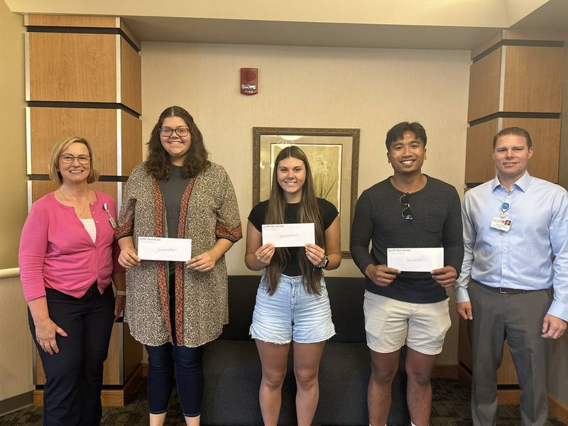 Scholarship recipients pictured with OSF Saint Clare leadership. From left to right, Jackie Kernan, president, Toni Newton, Kaia Robbins, Christian Rosario, John Bowser, director of Finance. Missing from photo: Julia Vander Meersch.