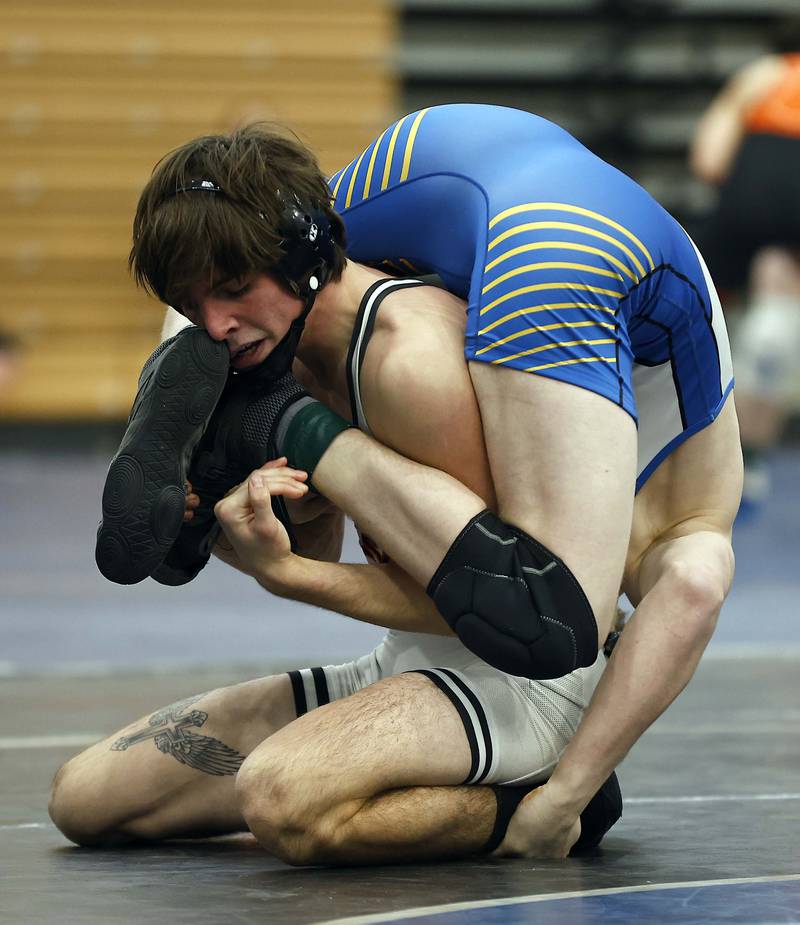 Wheaton North’s Thomas Fulton wrestles St. Charles East’s Ryan McGovern at 157-lbs at the 2025 DuKane Boys Varsity Tournament Saturday, Jan. 25, 2025 in St. Charles.