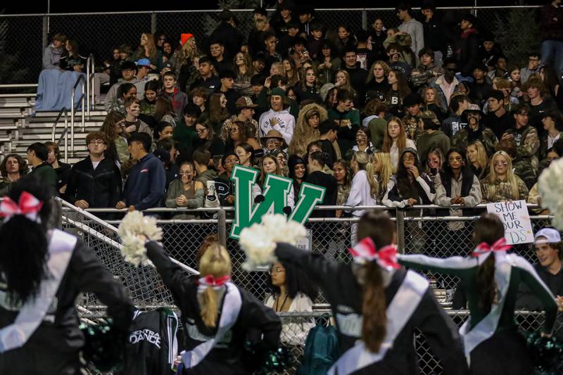 Plainfield Central's student section cheer on the team during football game between Joliet West at Plainfield Central.   Oct 20, 2023.