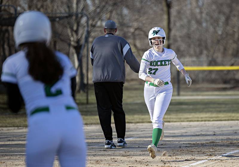 Rock Falls’ Rylee Johnson heads to the plate after hitting a home run in the second inning against Geneseo Wednesday March 29, 2023.
