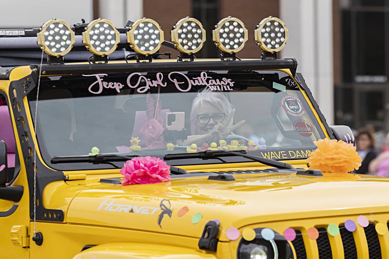 Jenny Bumba throws duces while moving through the Sauk Valley Fiesta Days parade Saturday, Sept. 16, 2023.