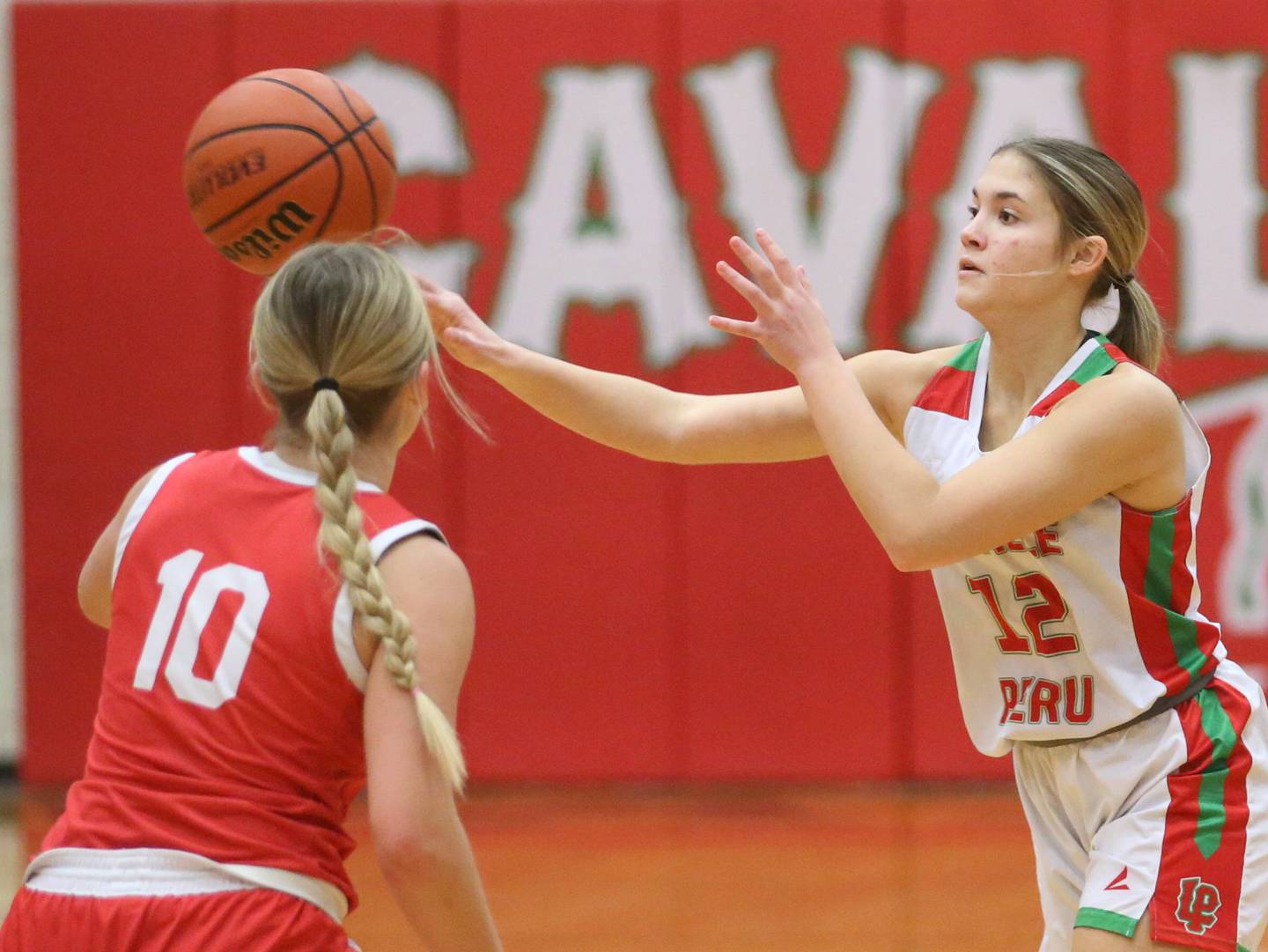 L-P's Phoebe Shetterly passes the ball around Ottawa's Ella Schmitz on Wednesday, Jan. 10, 2024 at Sellett Gymnasium.
