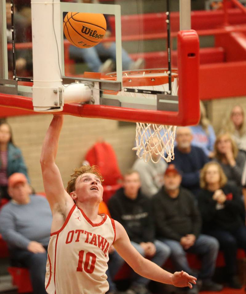 Ottawa's Evan Snook runs in all alone to score on a layup against Pontiac during the Dean Riley Shootin' The Rock Thanksgiving Tournament on Monday, Nov. 25, 2024 in Kingman Gym at Ottawa High School.