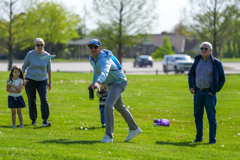 A player throws his disc during the Glen Ellyn Park District Ace Race disc golf event at Maryknoll Park in Glen Ellyn, IL on Saturday May 10th, 2025.  The Ace Race is just one of many events the Glen Ellyn Park District holds throughout the year.