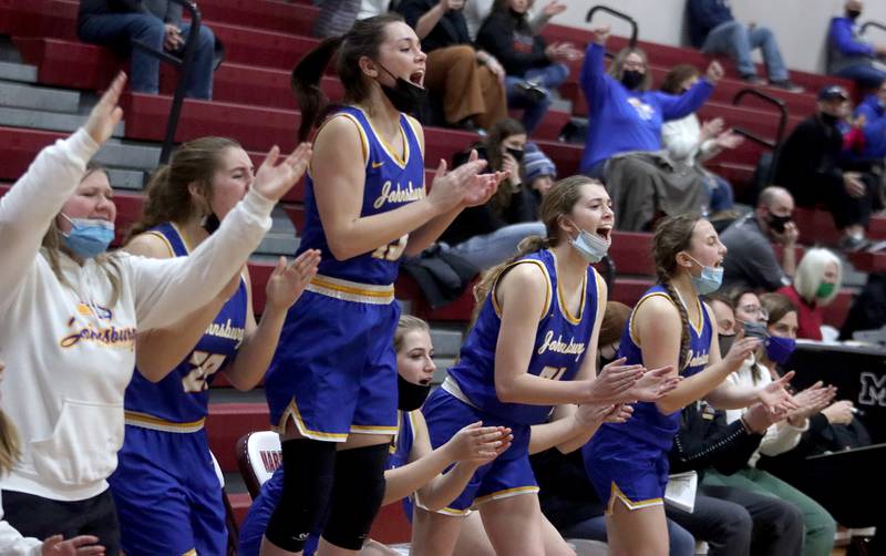Players on Johnsburg’s bench get revved up as the Skyhawks take their first lead of the game in the third quarter during girls varsity basketball action in Marengo Thursday night.
