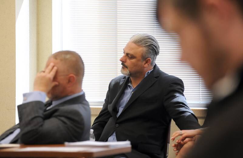 Tony Colatorti listens to proceedings Thursday, April 14, 2022, during a hearing of McHenry County electoral board at the McHenry County Administration Building in Woodstock. The board was to determine if Colatorti can remain on the ballot following an objection by William Brogan and Joel Brumlik over his qualifications to run for the position of McHenry County sheriff.