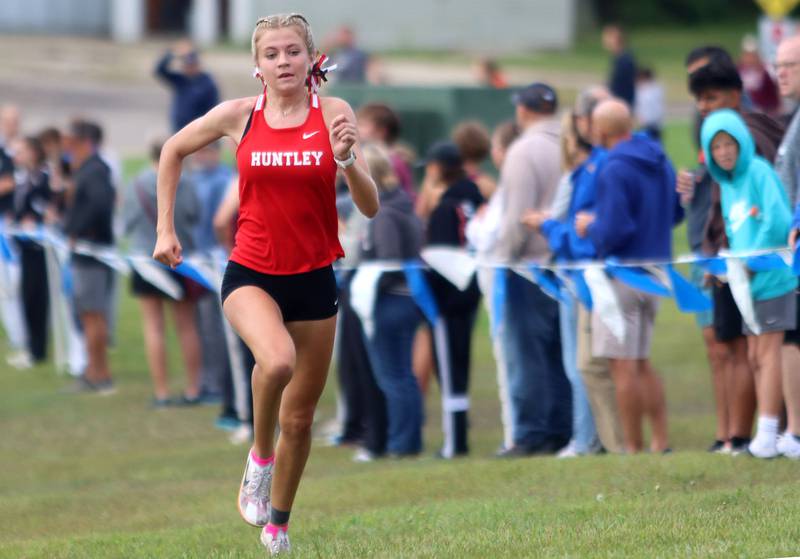Huntley’s Cori Kilvinger completes the girls varsity race during the McHenry County Cross Country Meet at Emricson park in Woodstock on Saturday, August 30, 2025.